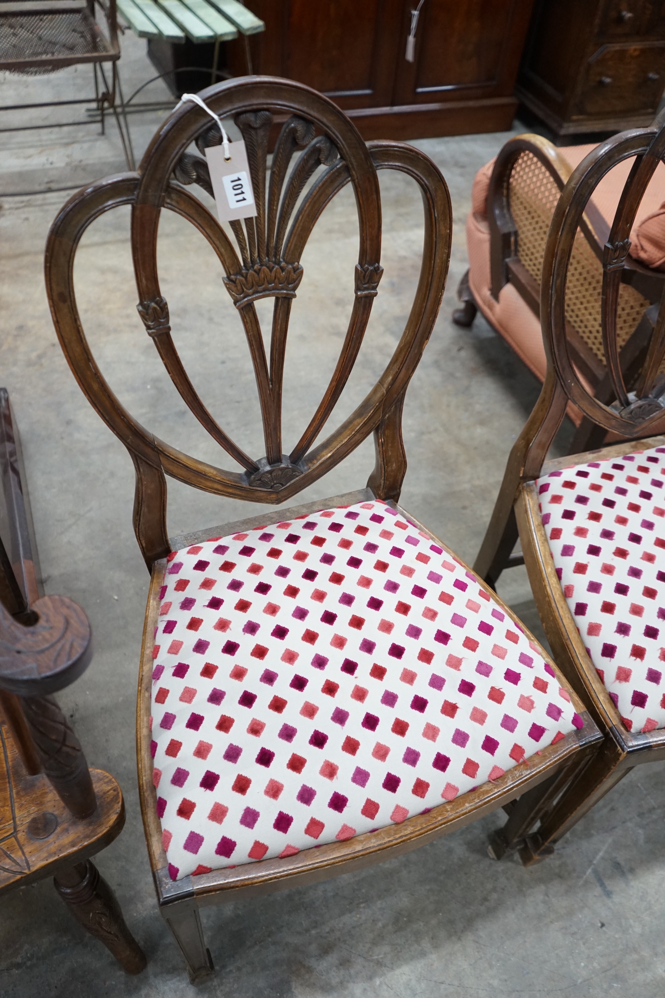 A set of eight Hepplewhite style mahogany dining chairs, two with arms